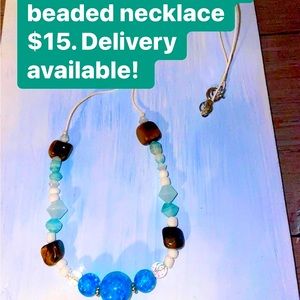 Hemp beaded necklace with Tiger Eye and Blue Crystalized beaded detail.